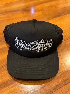 Black Trucker Hat with White Puakenikeni Flowers